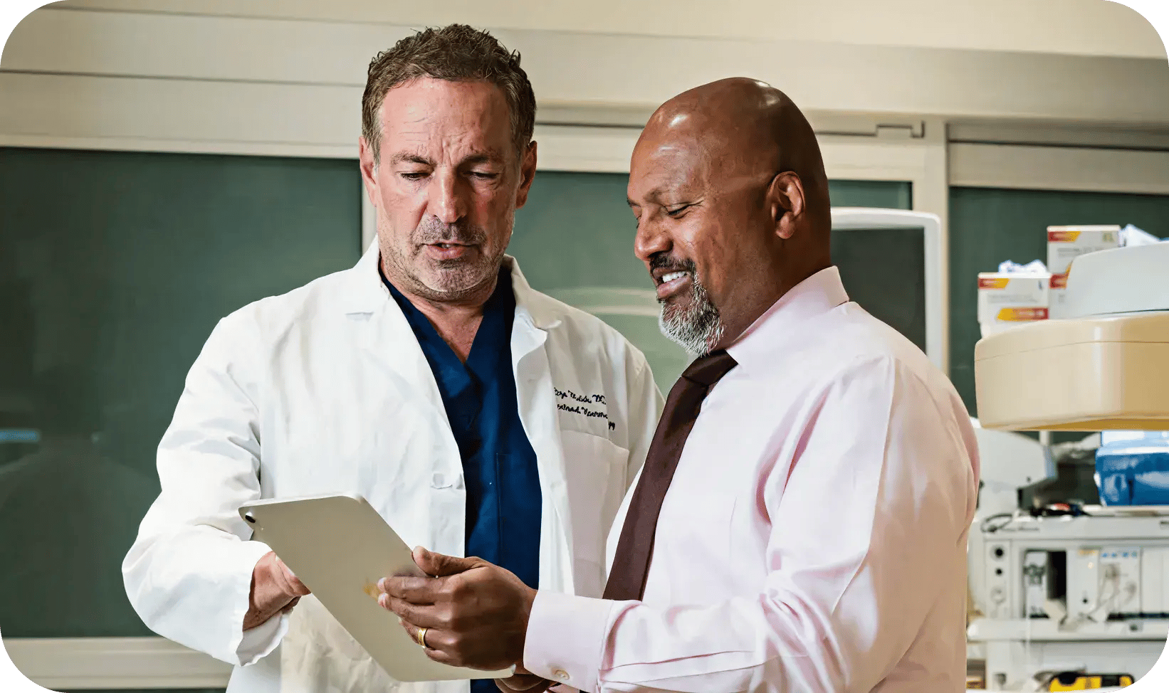 Two professionals examining medical data together.